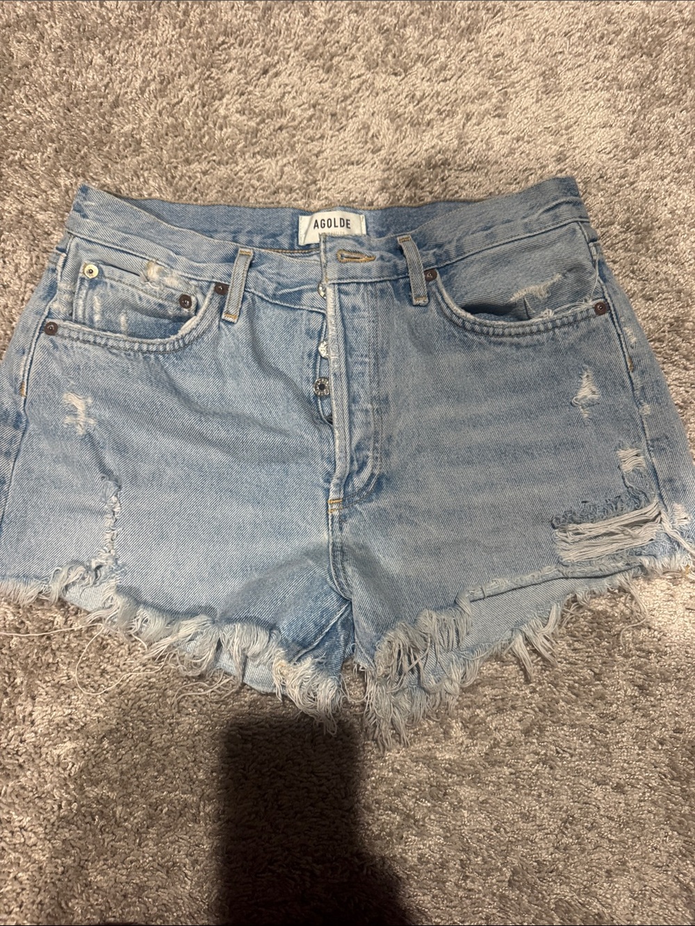Agolde light wash distressed denim cutoff shorts